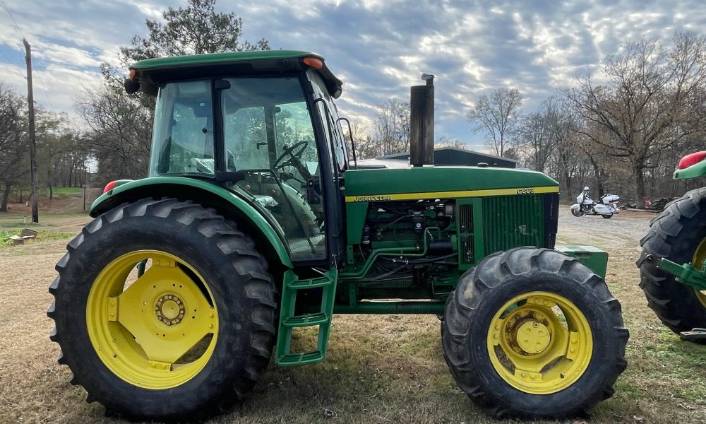 Photo of JOHN DEERE JD 6603 4WD FARM TRACTOR SN:P06603X002201 WITH ENCLOSED CAB (UTILITY):